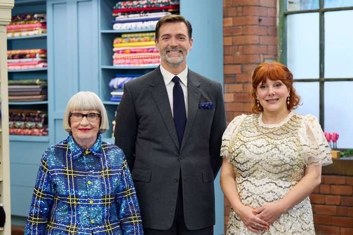 Esme Young, Patrick Grant and Sophie Willan on The Great British Sewing Bee season 12. Esme Young, Patrick Grant and Sophie Willan standing in a line.