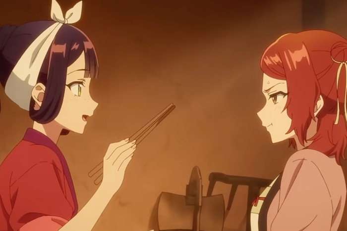 Two women in I Am An Inept Villainess, looking at one another. One is smiling and holding out chopsticks.