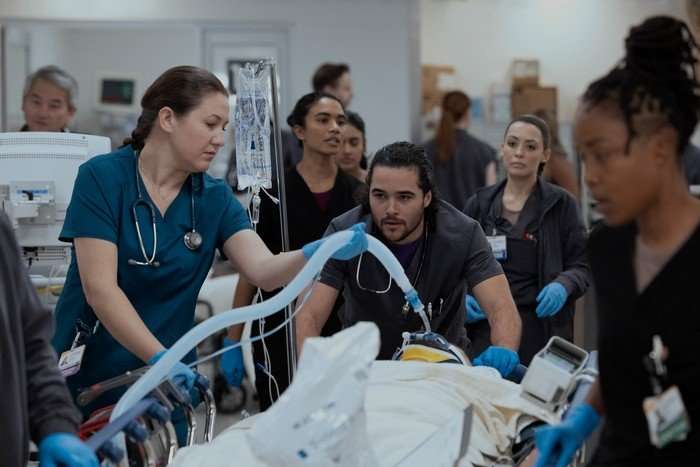 INT. CENTRAL WORK AREA/TRAUMA ONE SC.12/13 Ayesha Harris, Ambar Martinez, Supriya Ganesh, Shabana Azee in a hospital scene from The Pitt.