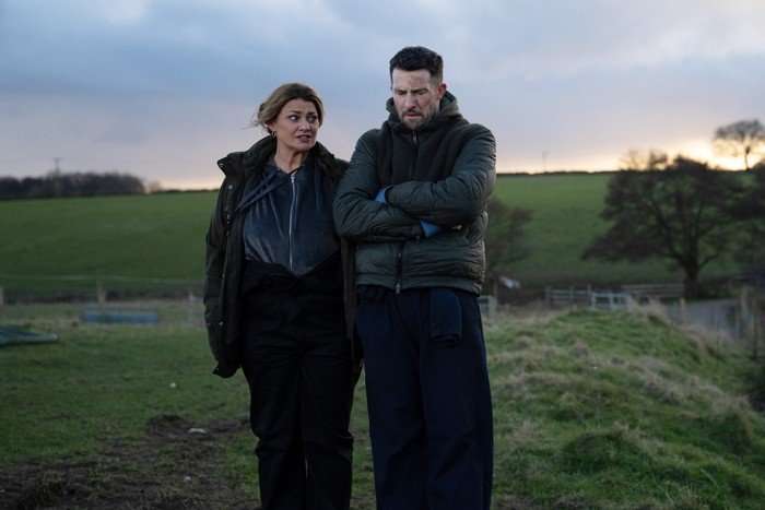 emmerdale-moira-ross Moira and Ross standing in a field in Emmerdale