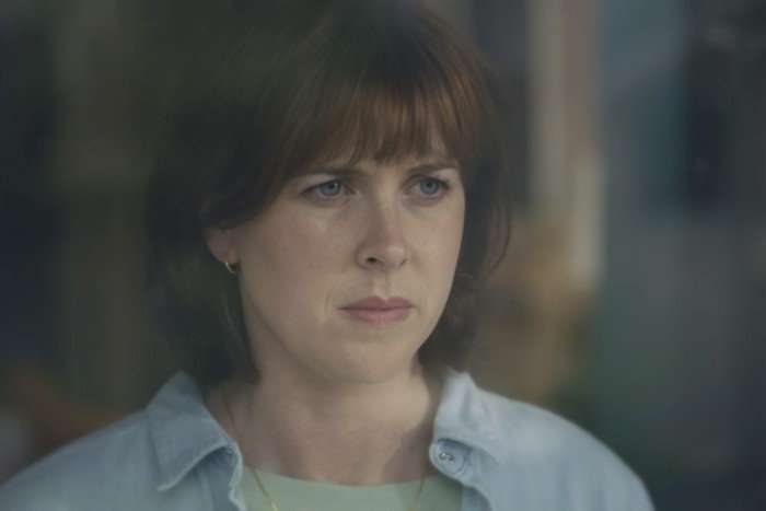 hunting-alice-bell-3 Alexandra Roach as Fran in Hunting Alice Bell looking seriously out of a window.