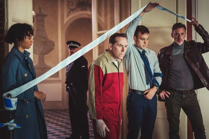 Professor T Ben Miller as Professor T, Andy Gathergood as Paul Rabbit, Emma Naomi as Lisa Dockers and Barney White as Dan Winters exiting a crime scene
