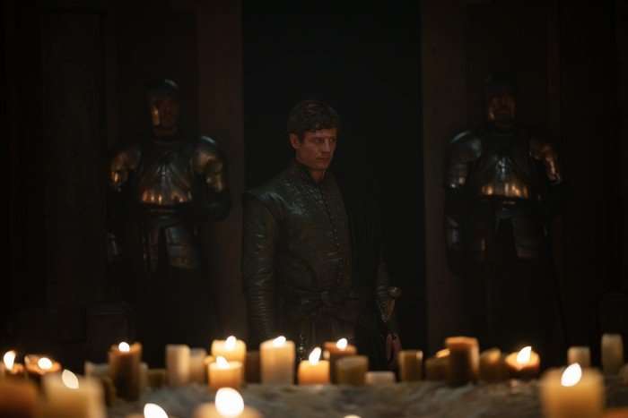 House of the Dragon james-norton- James Norton as Lord Ormund Hightower standing among candles in House of the Dragon season 3.