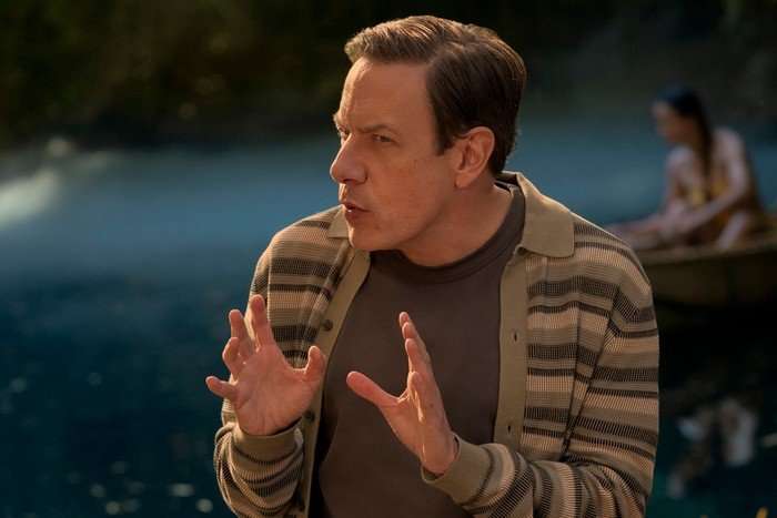 john-ross-bowie-stuart-fails-to-save-universe John Ross Bowie as Barry Kripke wearing a brown t-shirt and an unbuttoned striped shirt, holding his hands in front of him demonstrating.