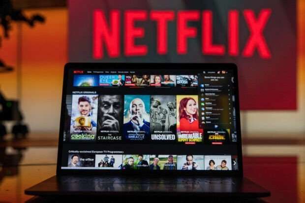 Illustrations Of Netflix, Spotify And Uber Logos Netflix
