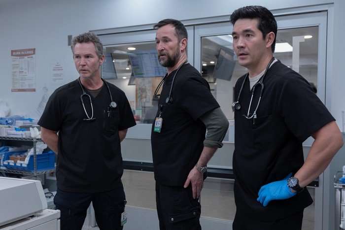shawn-hatosy-noah-wyle-ken-kirby Shawn Hatosy, Noah Wyle and Ken Kirby in The Pitt. They wear scrubs and each look with concern in the same direction.